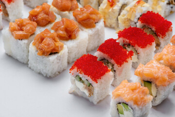 Sushi set with tuna, shrimp, salmon, and rice on the dark background