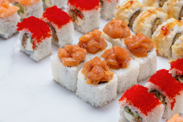 Sushi set with tuna, shrimp, salmon, and rice on the dark background
