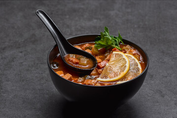 Soup with tomato, lemon and meat
