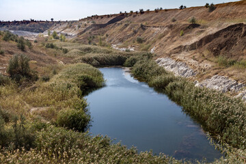A pond at the bottom of an old clay pit.