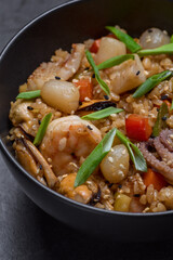 Ramen noodles with shrimp and octopus in bowl closeup