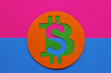 The coin with the bitcoin sign is connected to the dollar coin on a pink blue background. Conceptual collage about cryptocurrency in the power of cyberpunk and minimalism. High quality photo