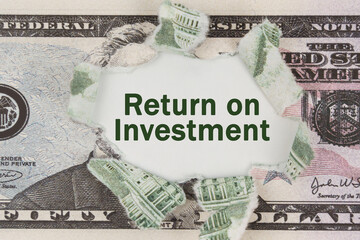 The dollar is torn in the center. In the center it is written - Return on Investment