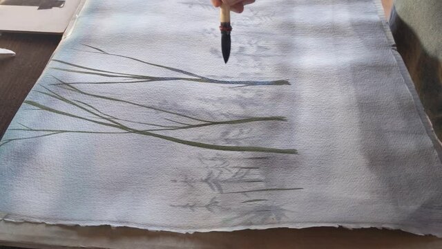 watercolorist at work, making of an artwork