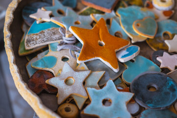 Products made of clay and porcelain. Colorful decorative stars - Powered by Adobe