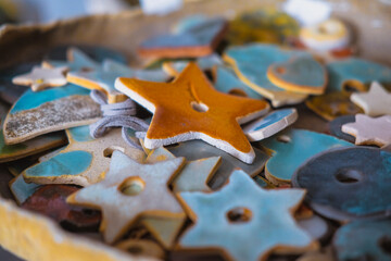 Products made of clay and porcelain. Colorful decorative stars