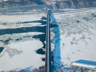 Kiev metro bridge across the Dnieper river. Aerial drone view. Winter sunny morning.