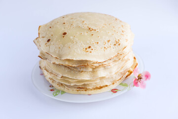 Stack of tasty pancakes on white background