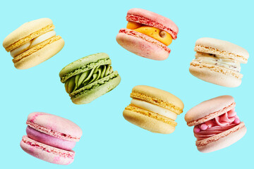 Close up of Traditional french cookies macarons of different colors and taste isolated on blue...