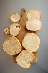 A slices of bread with butter on a chopping board. Flat lay. Flatlay