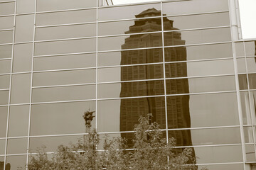 Skyscraper reflected in window