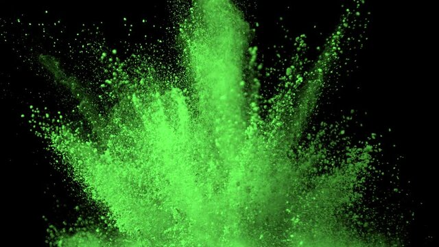 Super Slow Motion Shot of Green Powder Explosion Isolated on Black Background at 1000fps.