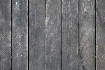 Fototapeta premium old dusty gray wooden plank wall. vertical lines. rough surface texture