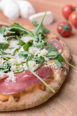 Pizza with raw ham