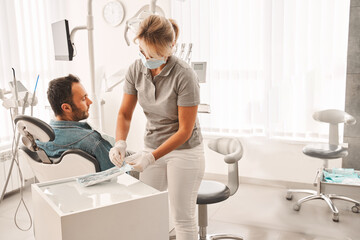 Patient sitting in dental chair and waiting for medical examination