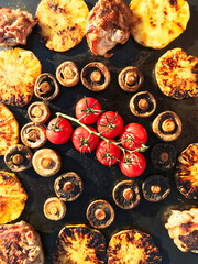 grilled meat with vegetables on grill