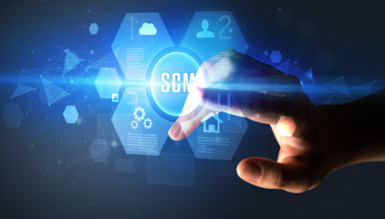 Hand touching SCM inscription, new technology concept