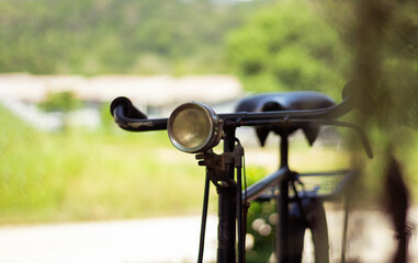 Fototapeta na wymiar Old retro bike with headlight. Soft focus.