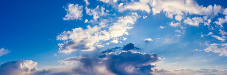 Beautiful sky panorama with white clouds. Natural background.