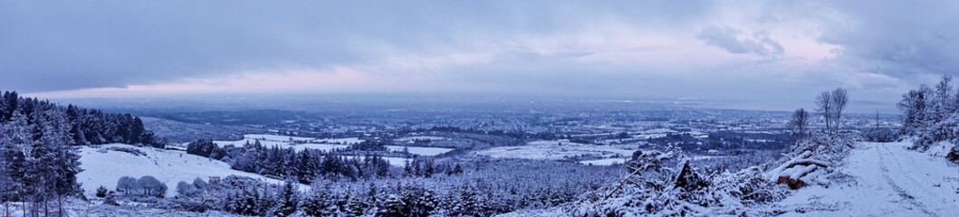 Beautiful winter panorama of South Dublin viewed from Ticknock Forest National Park, Co. Dublin, Ireland. Unusual Irish winter 2021. Rare landscape views