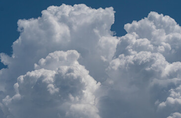 White fluffy big clouds against sky