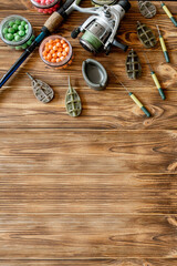 Accessories for carp fishing and fishing baits on wooden planks with copy space