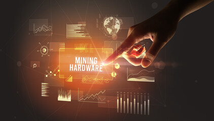 Fototapeta premium Hand touching MINING HARDWARE inscription, new business technology concept