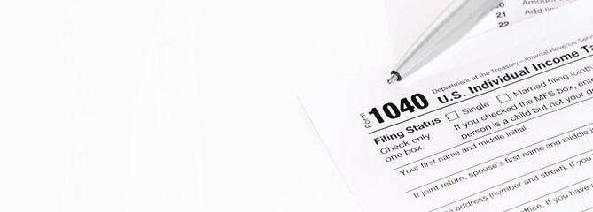 1040 Tax Form being filled out. Shallow depth of field