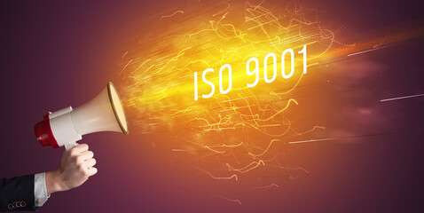 Young girld shouting in megaphone with ISO 9001 inscription, online shopping concept