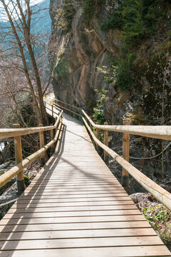 trail between rocks with impregnated pine wood barriers