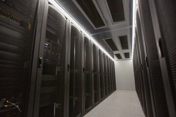 Wide angle background image of server room hall with supercomputer in data center or research facility, copy space