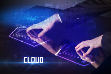 Hand touching digital table with CLOUD inscription, new age security concept