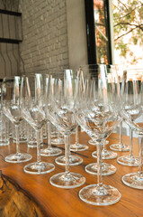 Glasses for white wine waiting for celebration. Creative layout.