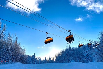 Ski chair lifts at Okemo mountain ski resort at sunny winter day in Vermont USA