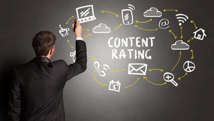businessman drawing social media icons with CONTENT RATING inscription, new media concept
