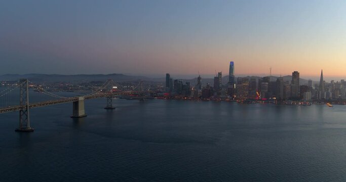 Oakland Bay Bridge and San Francisco Skyline at Sunset Aerial