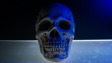 The skull in the blue light dark tone for background content