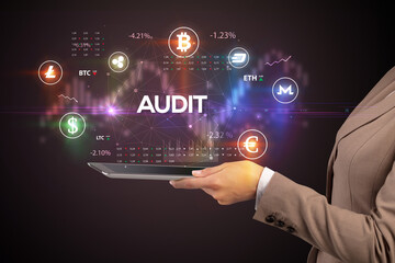 Close-up of a touchscreen with AUDIT inscription, business opportunity concept