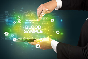 Close-up of a touchscreen with BLOOD SAMPLE inscription, medical concept