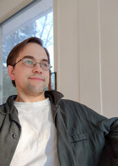 Casual dressed man with glasses relaxing