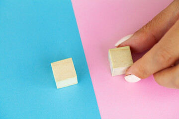 Hand putting and stacking blank wooden cubes on table with copy space for input wording and...