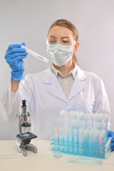 Fototapeta premium laboratory process of work on a vaccine against coronavirus, Virologist. Vertical photo, laboratory
