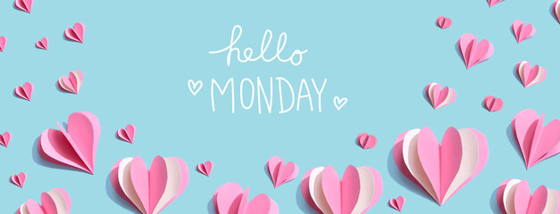 Hello Monday message with pink paper hearts - flat lay