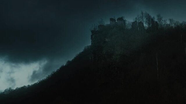 Medieval fortress silhouette on a stormy weather. Time lapse. No birds. This medieval fortress was the source of inspiration for the novel "The Carpathian Castle" by french author, Jules Verne.