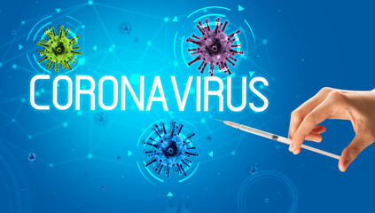 Syringe, medical injection in hand with CORONAVIRUS inscription, coronavirus vaccine concept