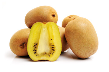 Whole and cut golden kiwifruit/ kiwi (Actinidia chinensis) on white background