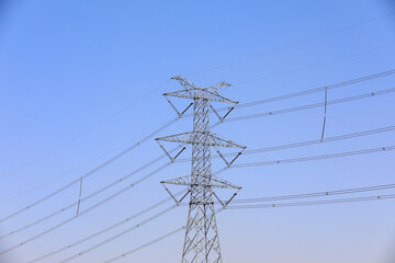 Power tower in the background of blue sky
