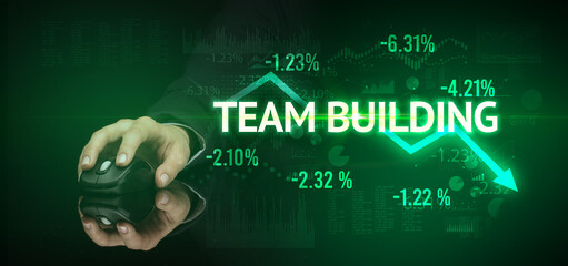 male hand holding wireless peripheral with TEAM BUILDING inscription, modern business concept
