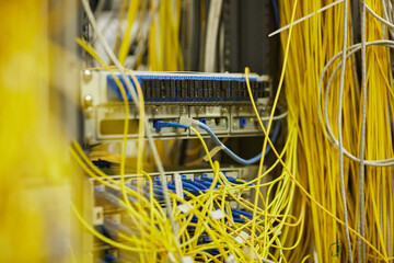 Close up background image of server room with internet cables and wires, copy space