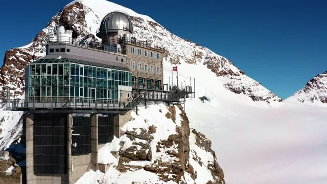 Close flight around the Sphinx Observatory on Jungfraujoch, Switzerland.